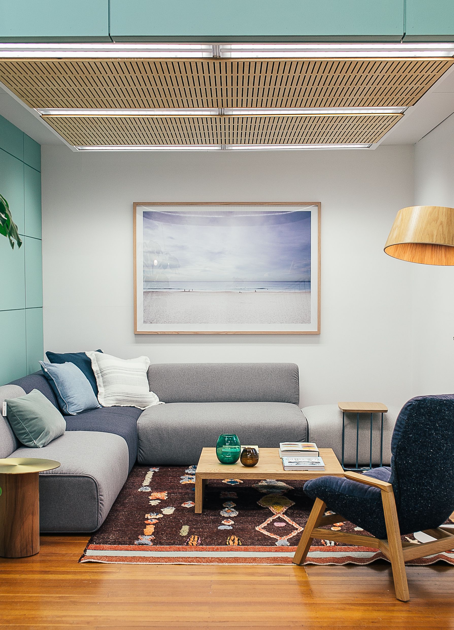Furniture photograph: upholstered sofa, wooden coffee table and armchair; not a customer shipment