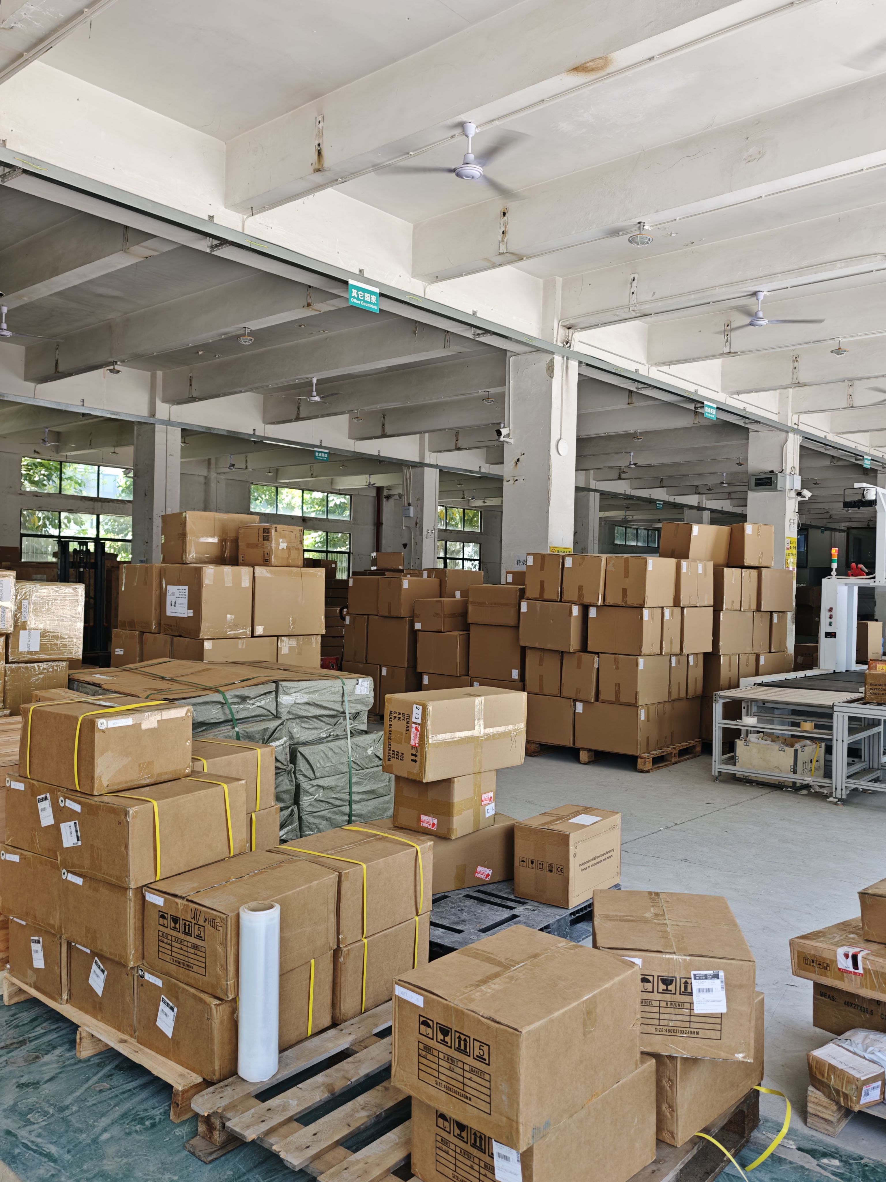 Cartons and handling equipment on the warehouse floor